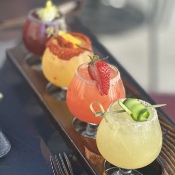 Clandestino signature dishes Duck CarnitasScallop AguachileMole NegroCraft Cocktails